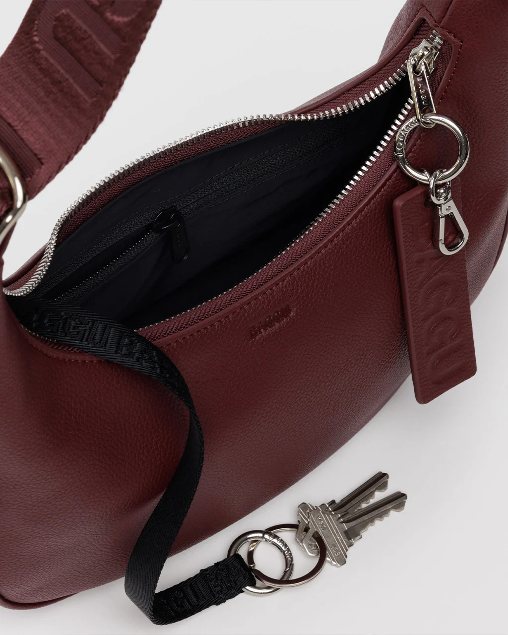 447-small-recycled-leather-crescent-bag-mahogany-1.webp